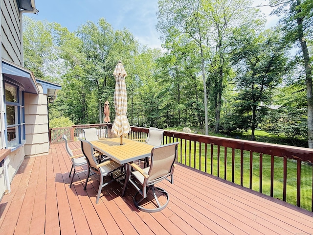 51 Boulder Brook Dr, Stamford, CT 06903 - deck with outdoor dining area, a lawn, and view of wooded area