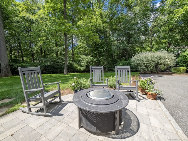 111 Washington Post Dr, Wilton, CT 06897 - view of patio / terrace with a fire pit and view of wooded area