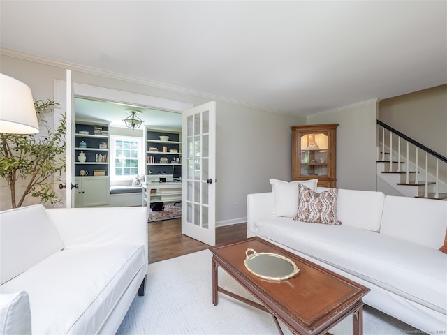 111 Washington Post Dr, Wilton, CT 06897 - living room with wood finished floors, stairway, crown molding, baseboards, and french doors