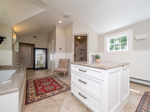 111 Washington Post Dr, Wilton, CT 06897 - entryway featuring wainscoting, vaulted ceiling, a baseboard radiator, and light tile patterned flooring