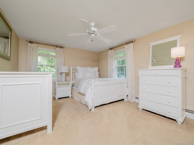 111 Washington Post Dr, Wilton, CT 06897 - bedroom featuring multiple windows, light carpet, and ceiling fan