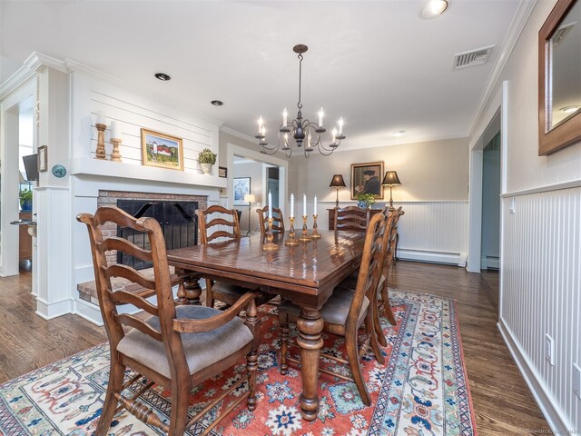 111 Washington Post Dr, Wilton, CT 06897 - dining space featuring a baseboard radiator, a wainscoted wall, a chandelier, dark wood-type flooring, and ornamental molding