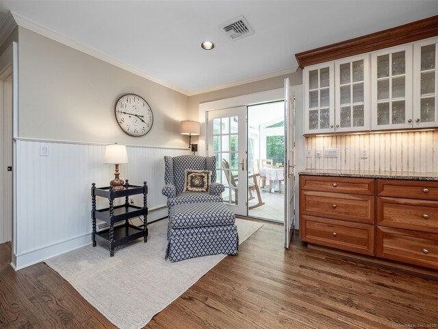 111 Washington Post Dr, Wilton, CT 06897 - living area with dark wood-style flooring, a wainscoted wall, crown molding, and recessed lighting