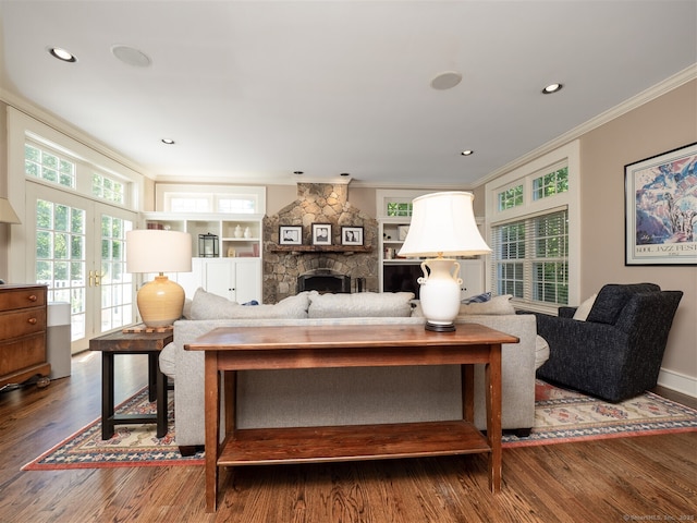 111 Washington Post Dr, Wilton, CT 06897 - living area with ornamental molding, wood finished floors, a fireplace, french doors, and recessed lighting