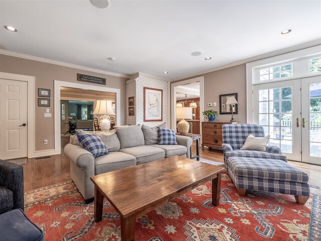 111 Washington Post Dr, Wilton, CT 06897 - living area featuring wood finished floors, crown molding, french doors, recessed lighting, and baseboards