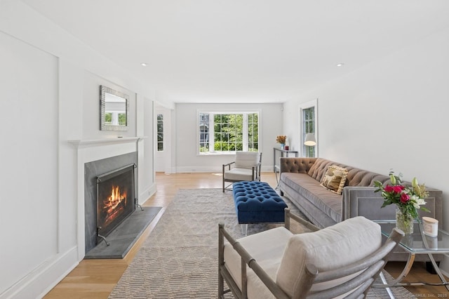 27 Waverly Rd, Darien, CT 06820 - living area with a lit fireplace, light wood-style floors, baseboards, and recessed lighting