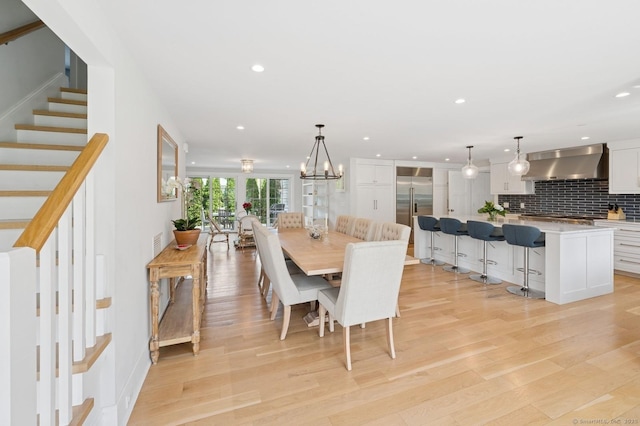 27 Waverly Rd, Darien, CT 06820 - dining space with stairway, light wood-style floors, recessed lighting, and a chandelier
