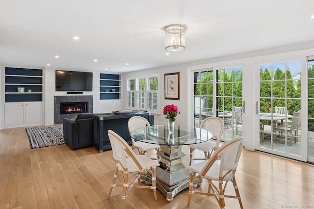 27 Waverly Rd, Darien, CT 06820 - dining room with light wood finished floors, a fireplace, recessed lighting, and built in features
