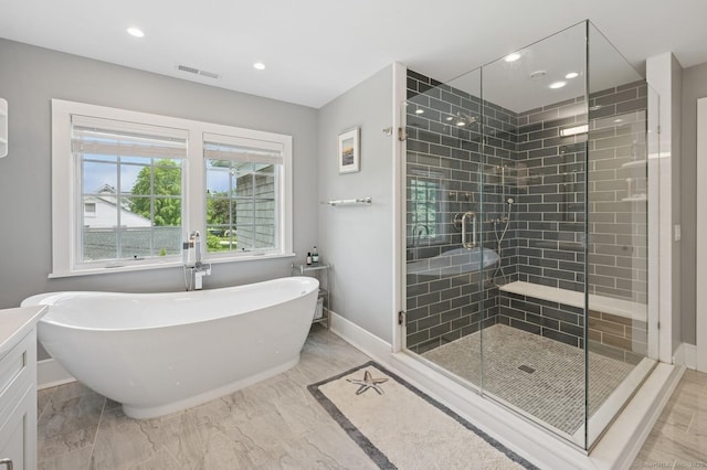27 Waverly Rd, Darien, CT 06820 - full bath featuring a soaking tub, baseboards, a stall shower, recessed lighting, and marble finish floors