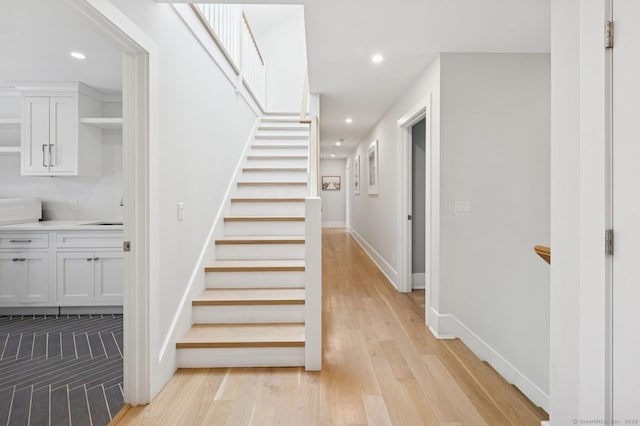 27 Waverly Rd, Darien, CT 06820 - stairway featuring recessed lighting, wood finished floors, and baseboards
