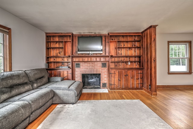 202 Mountain Rd, Cheshire, CT 06410 - living area featuring wood finished floors, a brick fireplace, baseboards, and built in features
