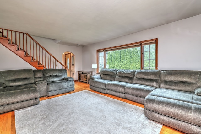 202 Mountain Rd, Cheshire, CT 06410 - living area with arched walkways, wood finished floors, and stairs