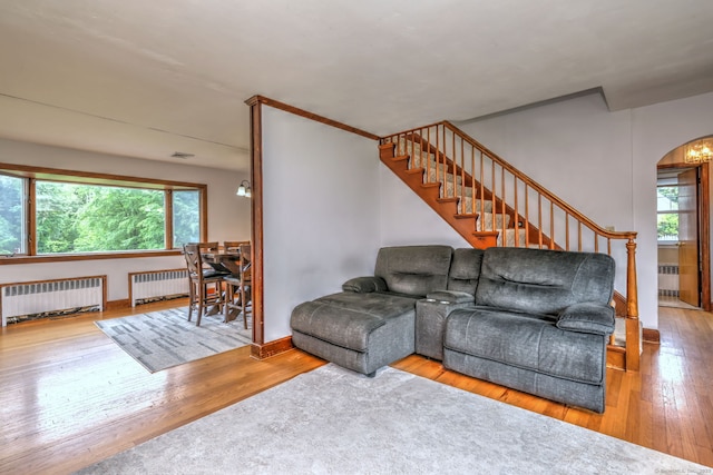 202 Mountain Rd, Cheshire, CT 06410 - living room with radiator, wood-type flooring, and arched walkways