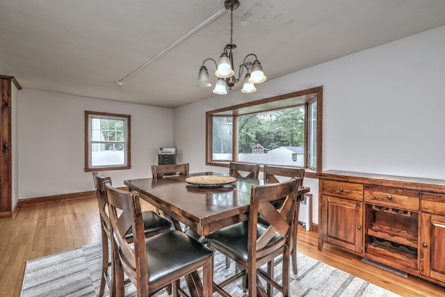 202 Mountain Rd, Cheshire, CT 06410 - dining space featuring a chandelier, light wood-type flooring, and baseboards