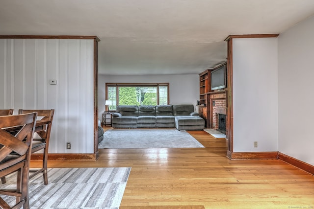 202 Mountain Rd, Cheshire, CT 06410 - living room with light wood finished floors, baseboards, and a brick fireplace