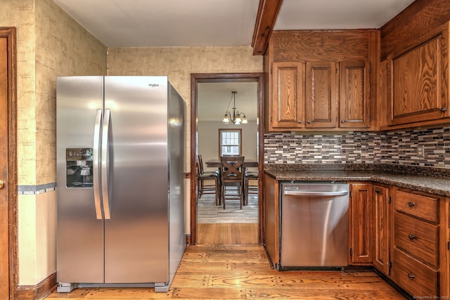 202 Mountain Rd, Cheshire, CT 06410 - kitchen with appliances with stainless steel finishes, light wood finished floors, dark countertops, and brown cabinetry
