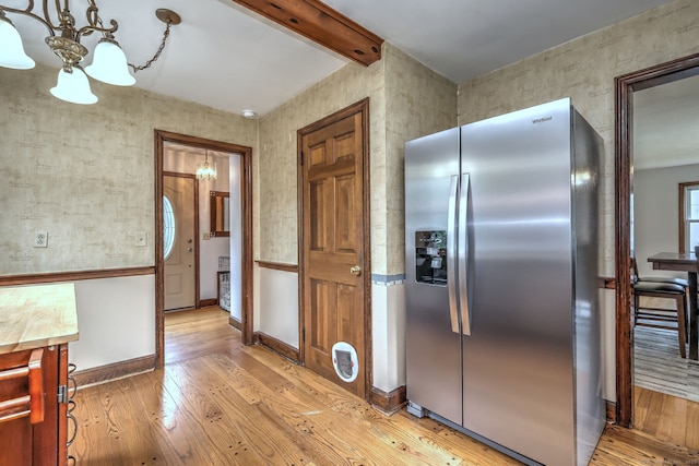 202 Mountain Rd, Cheshire, CT 06410 - kitchen with stainless steel refrigerator with ice dispenser, a chandelier, light wood-style flooring, and beamed ceiling