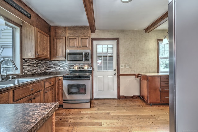 202 Mountain Rd, Cheshire, CT 06410 - kitchen featuring stainless steel appliances, a sink, beamed ceiling, light wood-type flooring, and dark countertops