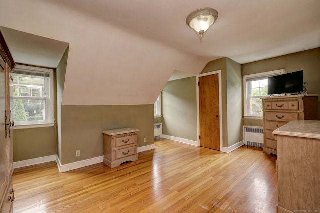 202 Mountain Rd, Cheshire, CT 06410 - additional living space featuring radiator heating unit, light wood-type flooring, vaulted ceiling, and baseboards