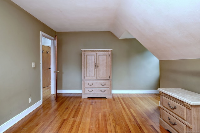 202 Mountain Rd, Cheshire, CT 06410 - additional living space with baseboards, light wood-type flooring, and vaulted ceiling