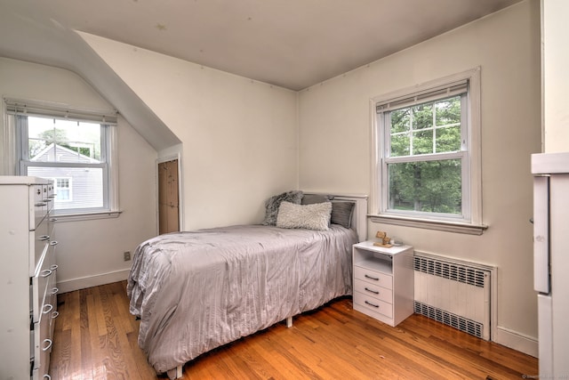 202 Mountain Rd, Cheshire, CT 06410 - bedroom featuring radiator, light wood-style floors, and baseboards