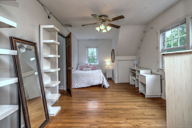 202 Mountain Rd, Cheshire, CT 06410 - bedroom featuring multiple windows, wood finished floors, vaulted ceiling, and ceiling fan