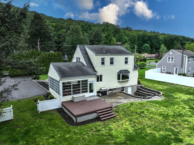 202 Mountain Rd, Cheshire, CT 06410 - rear view of property with roof with shingles, a forest view, a deck, and a chimney