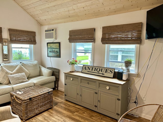 28 1st St, Madison, CT 06443 - living room featuring lofted ceiling, a wall unit AC, healthy amount of natural light, wooden ceiling, and wood finished floors