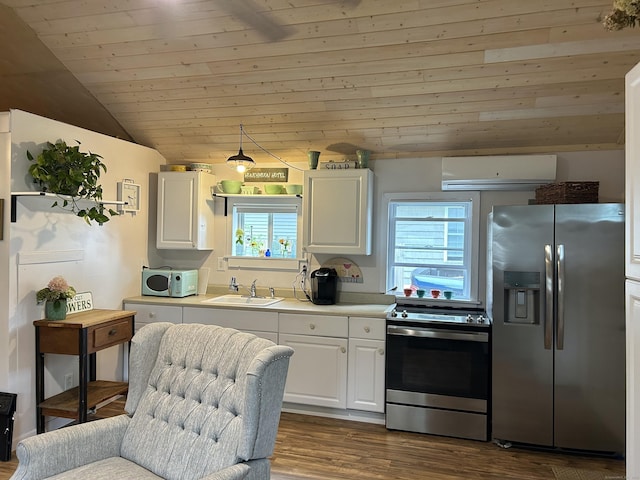 28 1st St, Madison, CT 06443 - kitchen featuring stainless steel appliances, a wall unit AC, lofted ceiling, white cabinetry, and wooden ceiling