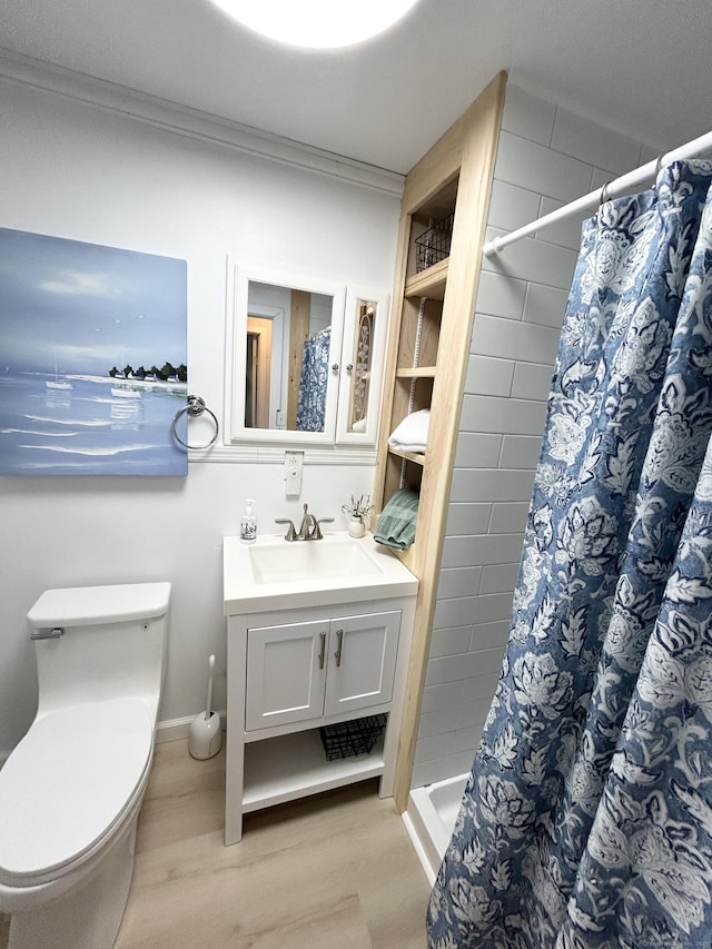 28 1st St, Madison, CT 06443 - full bathroom featuring vanity, wood finished floors, curtained shower, and ornamental molding