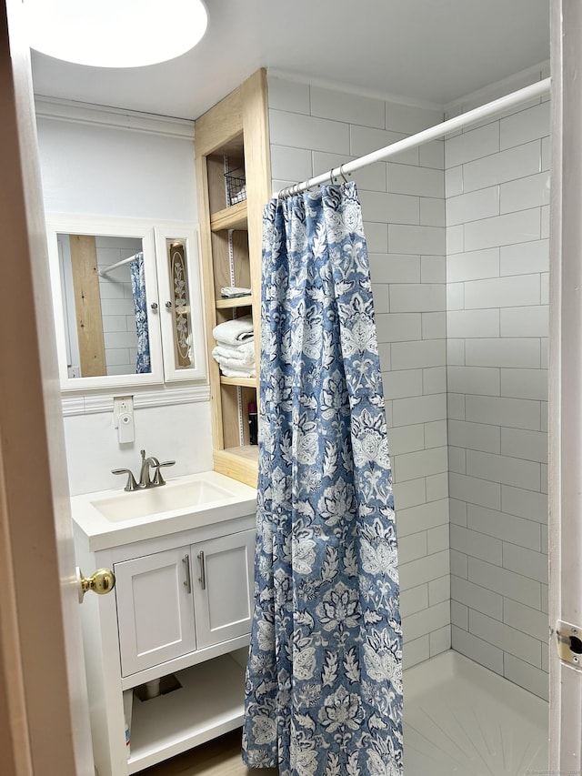 28 1st St, Madison, CT 06443 - bathroom with a stall shower, vanity, and ornamental molding