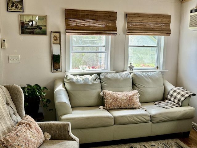 28 1st St, Madison, CT 06443 - living area with wood finished floors and a wall unit AC