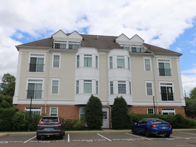 144 E Ave Apt B106, Norwalk, CT 06851 - view of building exterior with uncovered parking