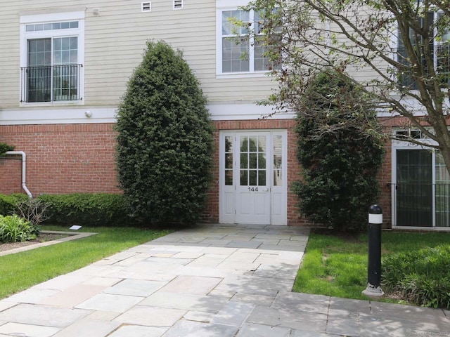 144 E Ave Apt B106, Norwalk, CT 06851 - doorway to property with brick siding