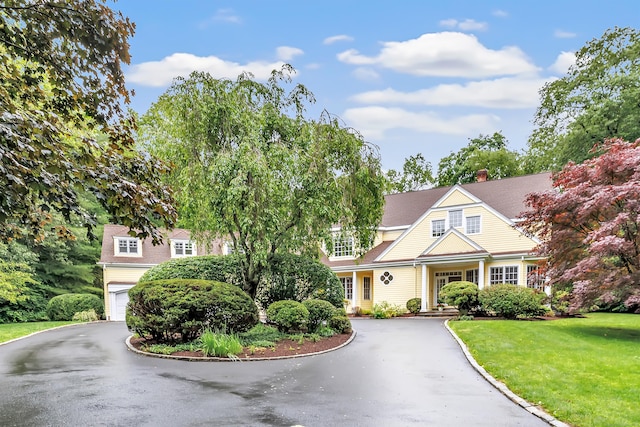 4 Lyons Plain Rd, Weston, CT 06883 - shingle-style home featuring asphalt driveway, an attached garage, and a front yard