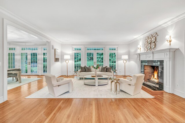 4 Lyons Plain Rd, Weston, CT 06883 - living room with wood finished floors, a premium fireplace, french doors, and crown molding