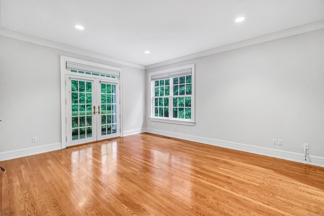 4 Lyons Plain Rd, Weston, CT 06883 - empty room with crown molding, light wood-style floors, recessed lighting, and french doors