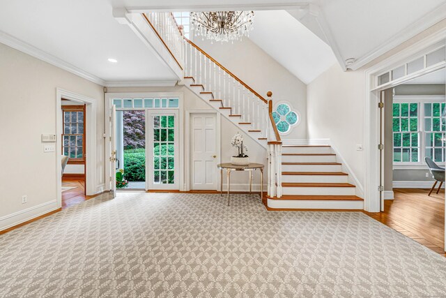 4 Lyons Plain Rd, Weston, CT 06883 - entrance foyer with stairway, a chandelier, ornamental molding, wood finished floors, and recessed lighting