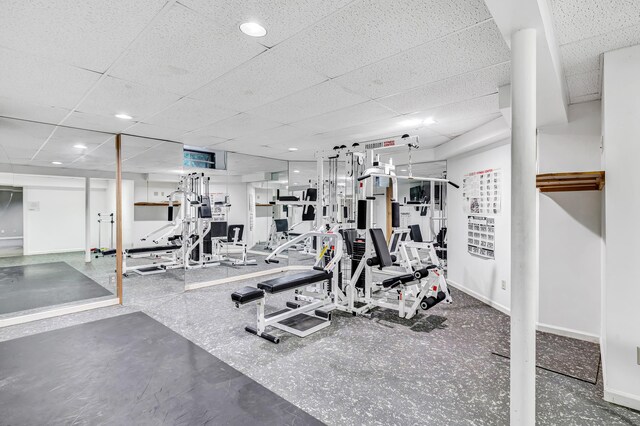4 Lyons Plain Rd, Weston, CT 06883 - exercise room featuring a drop ceiling and baseboards
