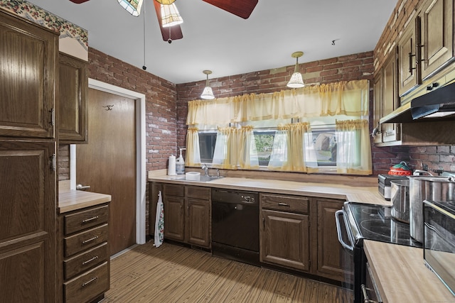 337 Woodbine Rd, Stamford, CT 06903 - kitchen featuring black appliances, a ceiling fan, brick wall, a sink, and wood counters