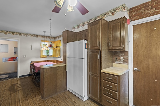 337 Woodbine Rd, Stamford, CT 06903 - kitchen with freestanding refrigerator, a ceiling fan, wood finished floors, light countertops, and baseboards