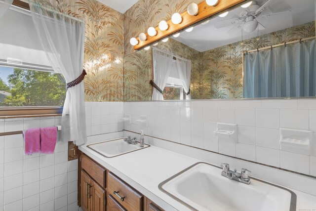 337 Woodbine Rd, Stamford, CT 06903 - full bathroom with wallpapered walls, tile walls, healthy amount of natural light, double vanity, and ceiling fan