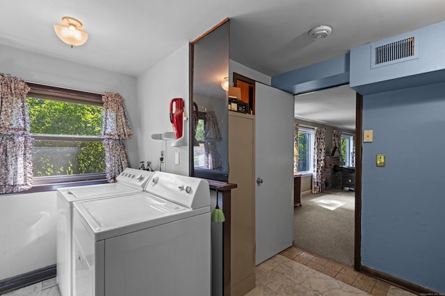 337 Woodbine Rd, Stamford, CT 06903 - laundry room featuring separate washer and dryer, baseboards, and light marble finish flooring