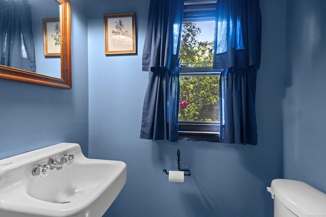 337 Woodbine Rd, Stamford, CT 06903 - half bathroom featuring a sink and toilet