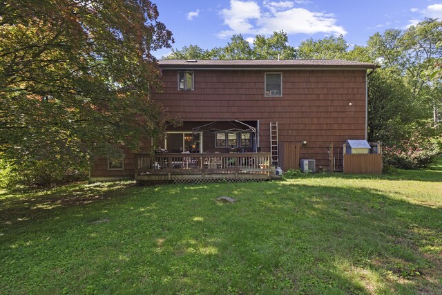 337 Woodbine Rd, Stamford, CT 06903 - rear view of house with a deck, a yard, and central AC