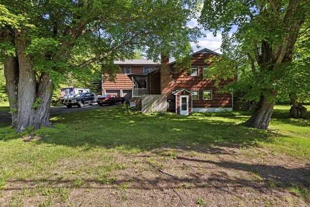 337 Woodbine Rd, Stamford, CT 06903 - view of grassy yard with asphalt driveway