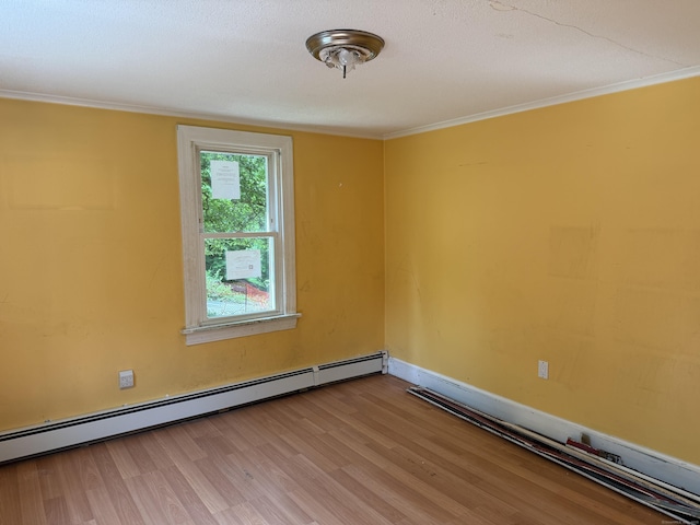 34 Buckingham Ave, Norwich, CT 06360 - unfurnished room featuring a baseboard radiator, wood finished floors, and crown molding