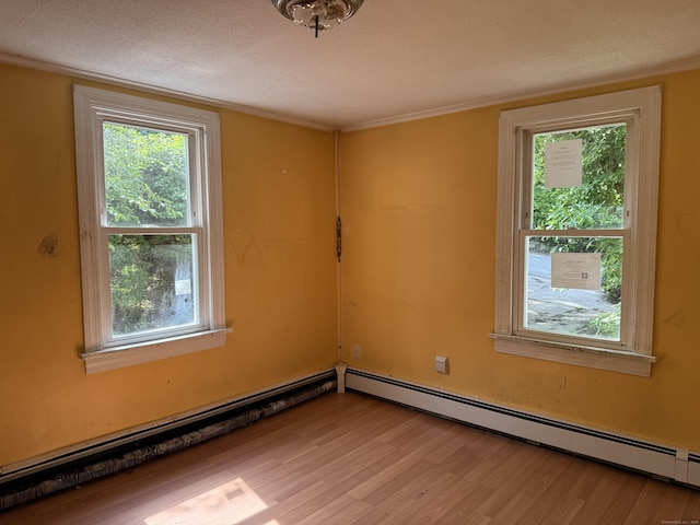 34 Buckingham Ave, Norwich, CT 06360 - spare room with light wood-style flooring, baseboard heating, a textured ceiling, and a baseboard heating unit