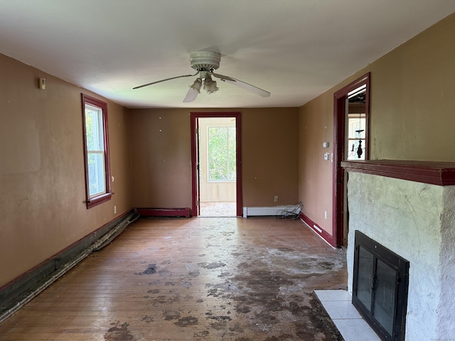 34 Buckingham Ave, Norwich, CT 06360 - unfurnished living room with a ceiling fan, baseboard heating, a tile fireplace, and baseboards