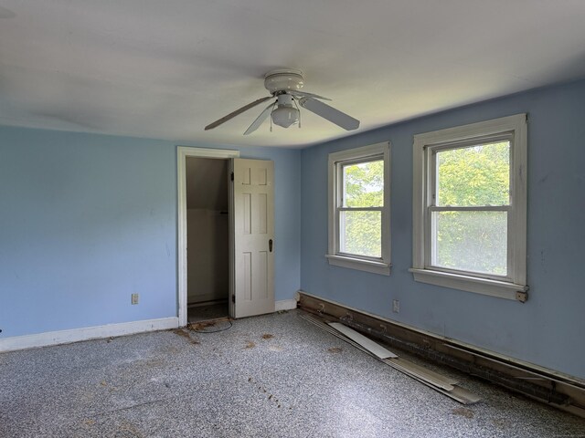 34 Buckingham Ave, Norwich, CT 06360 - unfurnished bedroom with baseboards, ceiling fan, and a closet